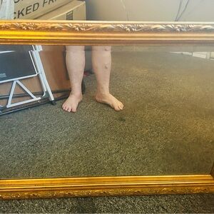 Michaels Ornate Gold Framed heavy Wall mirror.Mint condition purchased hung 1993